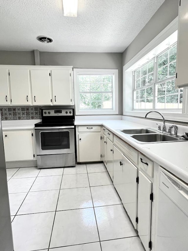 115 Westmont Dr, Dothan, AL 36301 - kitchen with stainless steel range with electric cooktop, dishwasher, a textured ceiling, light countertops, and white cabinets