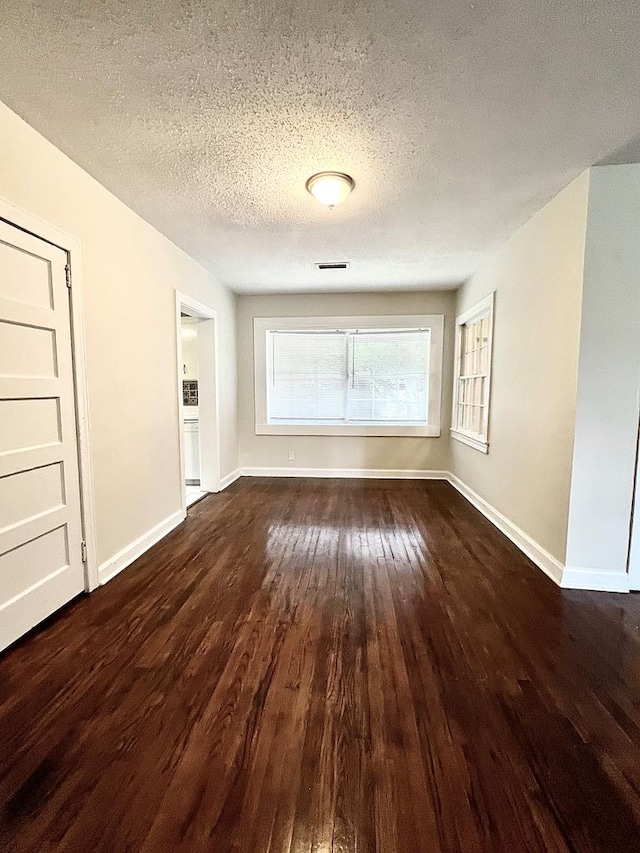 115 Westmont Dr, Dothan, AL 36301 - empty room with wood-type flooring and a textured ceiling