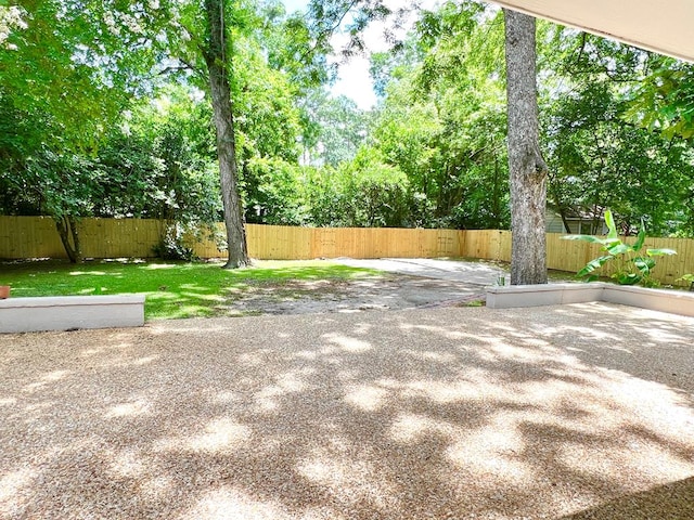115 Westmont Dr, Dothan, AL 36301 - fenced backyard featuring a patio area