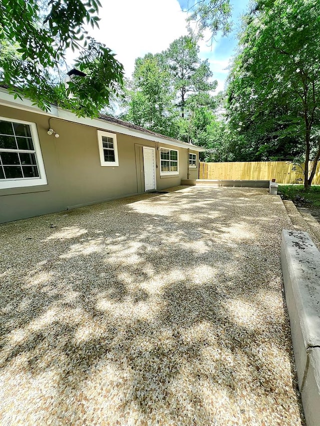 115 Westmont Dr, Dothan, AL 36301 - back of property with stucco siding and a patio