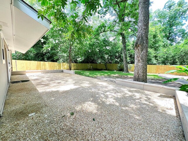 115 Westmont Dr, Dothan, AL 36301 - fenced backyard with a patio