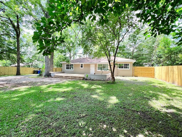 115 Westmont Dr, Dothan, AL 36301 - rear view of property featuring a fenced backyard, a patio area, and stucco siding