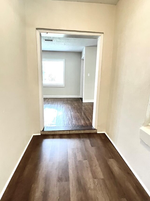 115 Westmont Dr, Dothan, AL 36301 - corridor with wood finished floors and baseboards