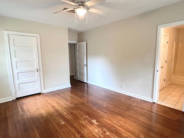 115 Westmont Dr, Dothan, AL 36301 - unfurnished bedroom with wood-type flooring, a textured ceiling, and ceiling fan