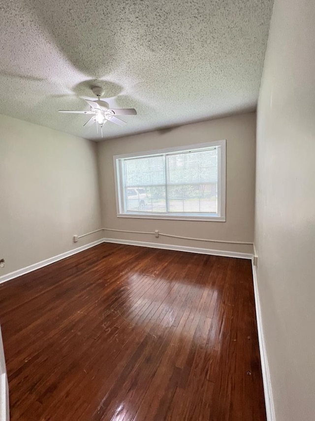 115 Westmont Dr, Dothan, AL 36301 - unfurnished room with dark wood-style flooring, a ceiling fan, and a textured ceiling
