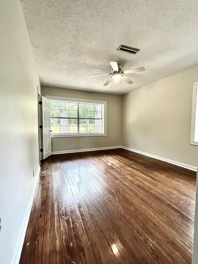 115 Westmont Dr, Dothan, AL 36301 - unfurnished room with dark wood-style floors, ceiling fan, and a textured ceiling