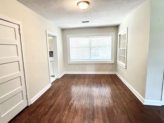 115 Westmont Dr, Dothan, AL 36301 - unfurnished dining area featuring dark wood finished floors and a textured ceiling