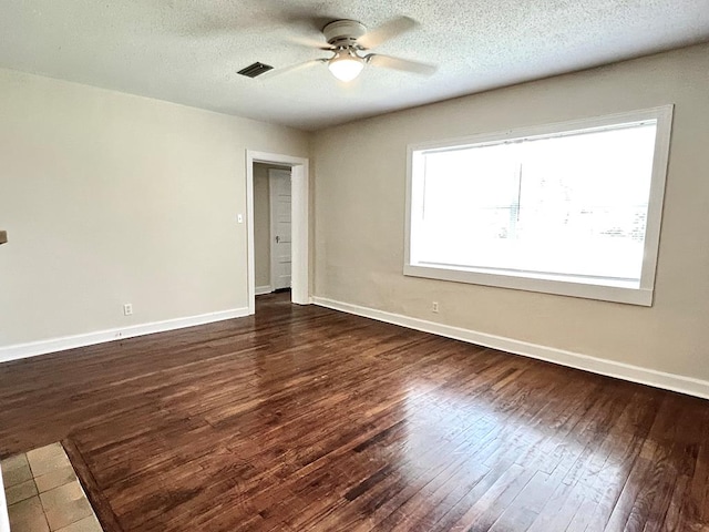 115 Westmont Dr, Dothan, AL 36301 - empty room with ceiling fan, dark wood finished floors, and a textured ceiling