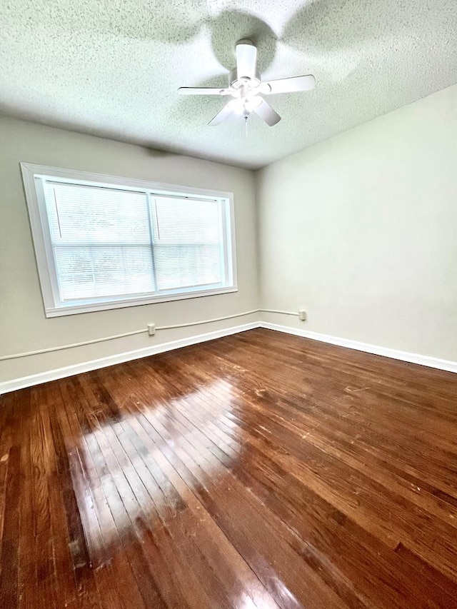 115 Westmont Dr, Dothan, AL 36301 - empty room with hardwood / wood-style floors, a ceiling fan, and a textured ceiling