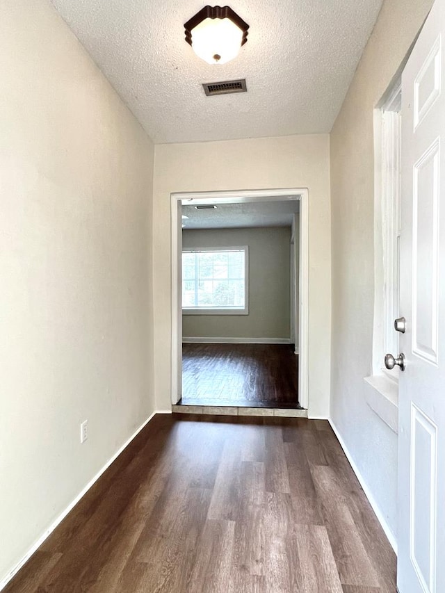 115 Westmont Dr, Dothan, AL 36301 - corridor featuring wood finished floors and a textured ceiling