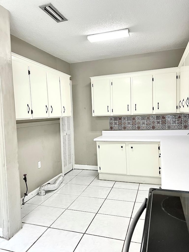 115 Westmont Dr, Dothan, AL 36301 - washroom with a textured ceiling and light tile patterned floors