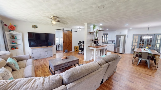 207 Seeba Dr, Dothan, AL 36303 - living room featuring a barn door, light wood-style flooring, recessed lighting, and ceiling fan