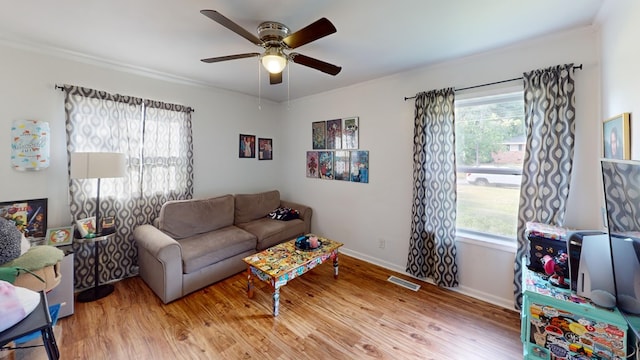 207 Seeba Dr, Dothan, AL 36303 - living room featuring plenty of natural light, ornamental molding, light wood-style floors, and ceiling fan
