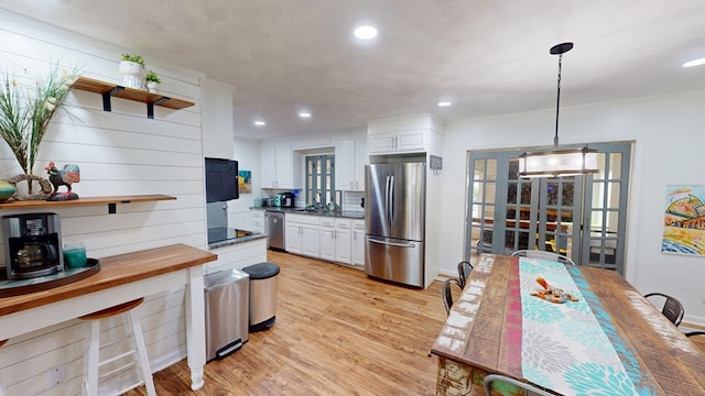 207 Seeba Dr, Dothan, AL 36303 - kitchen with stainless steel appliances, open shelves, wooden counters, white cabinets, and recessed lighting