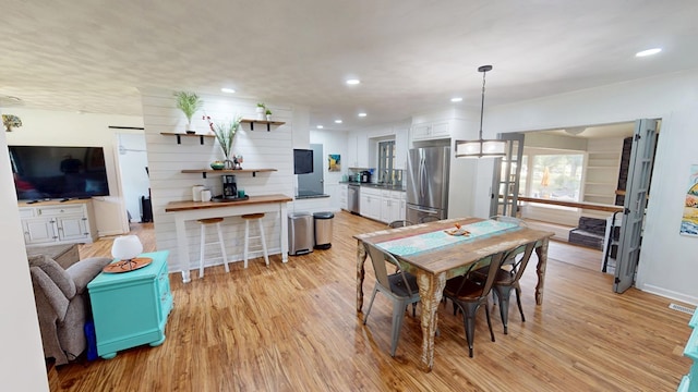 207 Seeba Dr, Dothan, AL 36303 - dining area with light wood-style flooring and recessed lighting
