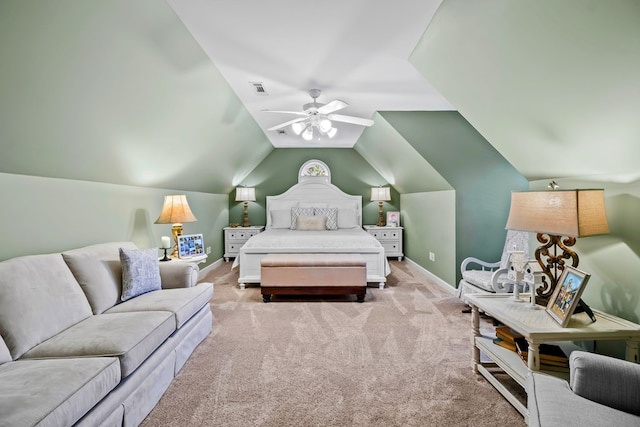 bedroom with lofted ceiling, baseboards, visible vents, and light colored carpet