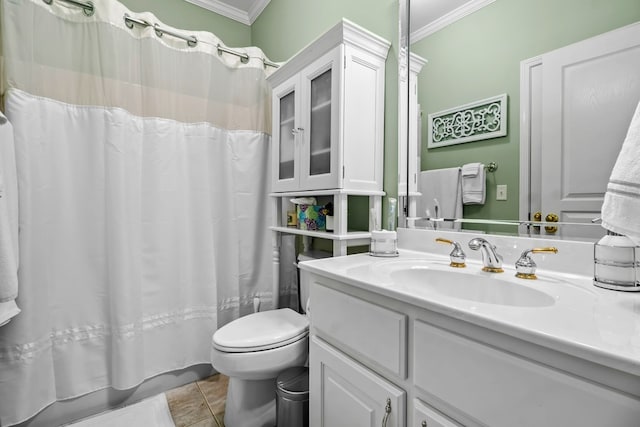 bathroom featuring vanity, tile patterned floors, toilet, and crown molding