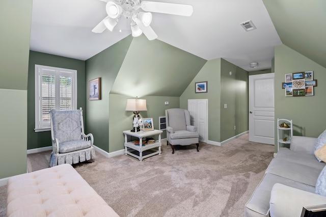 interior space featuring lofted ceiling, baseboards, visible vents, and light colored carpet