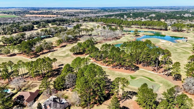 aerial view with golf course view and a water view