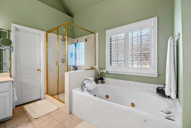 bathroom featuring vanity, vaulted ceiling, a shower stall, tile patterned floors, and a whirlpool tub