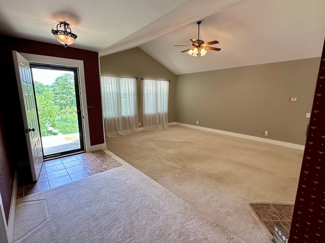 426 Walker Rd, Ozark, AL 36360 - carpeted foyer entrance featuring a ceiling fan, vaulted ceiling, and tile patterned flooring