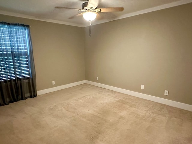 426 Walker Rd, Ozark, AL 36360 - unfurnished room with light colored carpet, a ceiling fan, and crown molding