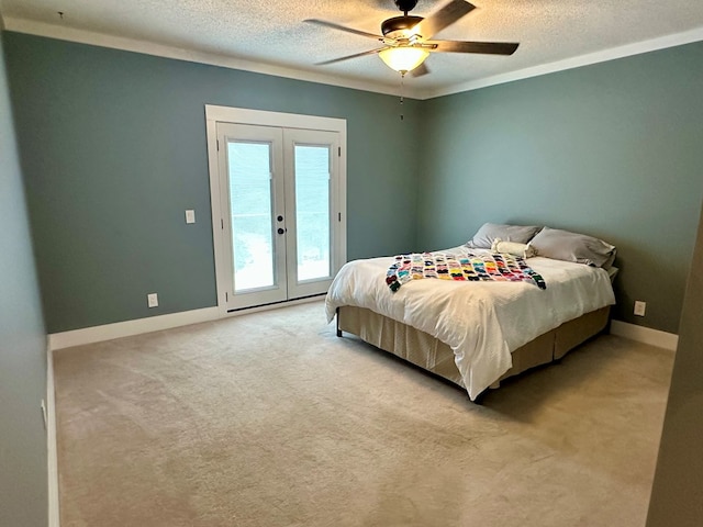 426 Walker Rd, Ozark, AL 36360 - bedroom with access to exterior, french doors, a textured ceiling, light colored carpet, and ceiling fan