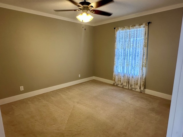426 Walker Rd, Ozark, AL 36360 - empty room with light carpet, ceiling fan, and ornamental molding