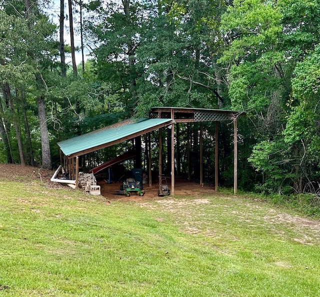 426 Walker Rd, Ozark, AL 36360 - view of green lawn featuring a detached carport