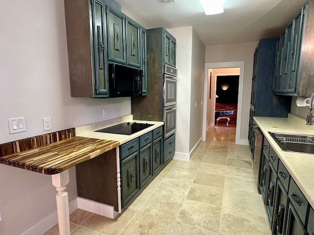 426 Walker Rd, Ozark, AL 36360 - kitchen with black appliances and a sink