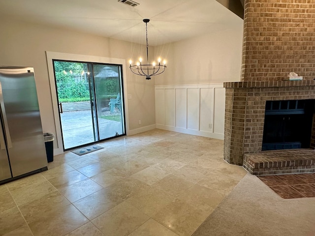 426 Walker Rd, Ozark, AL 36360 - unfurnished dining area with a chandelier and a fireplace
