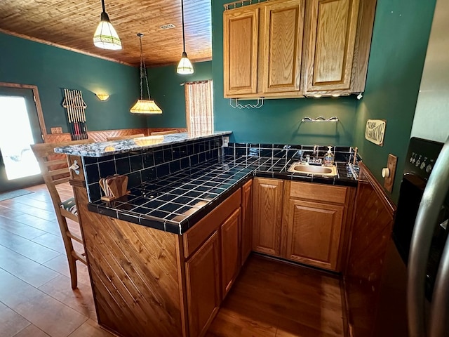 426 Walker Rd, Ozark, AL 36360 - bar area featuring decorative light fixtures, wooden ceiling, dark wood-style flooring, and crown molding