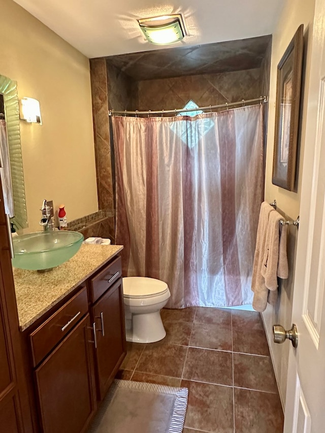 426 Walker Rd, Ozark, AL 36360 - bathroom with vanity, tile patterned flooring, and a shower with curtain