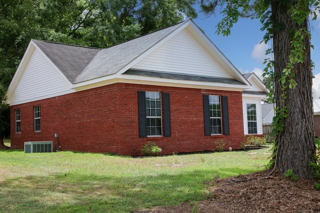 40 Caravan Ln, Kinsey, AL 36303 - view of side of home with brick siding, a lawn, central air condition unit, and roof with shingles