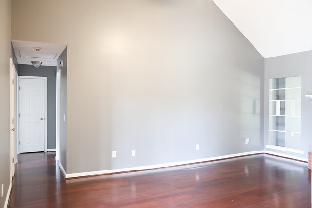 40 Caravan Ln, Kinsey, AL 36303 - unfurnished room with wood finished floors, baseboards, vaulted ceiling, and attic access