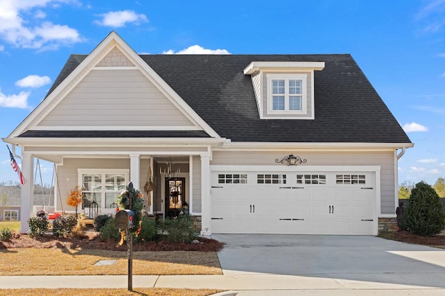 view of front of house with covered porch and a garage