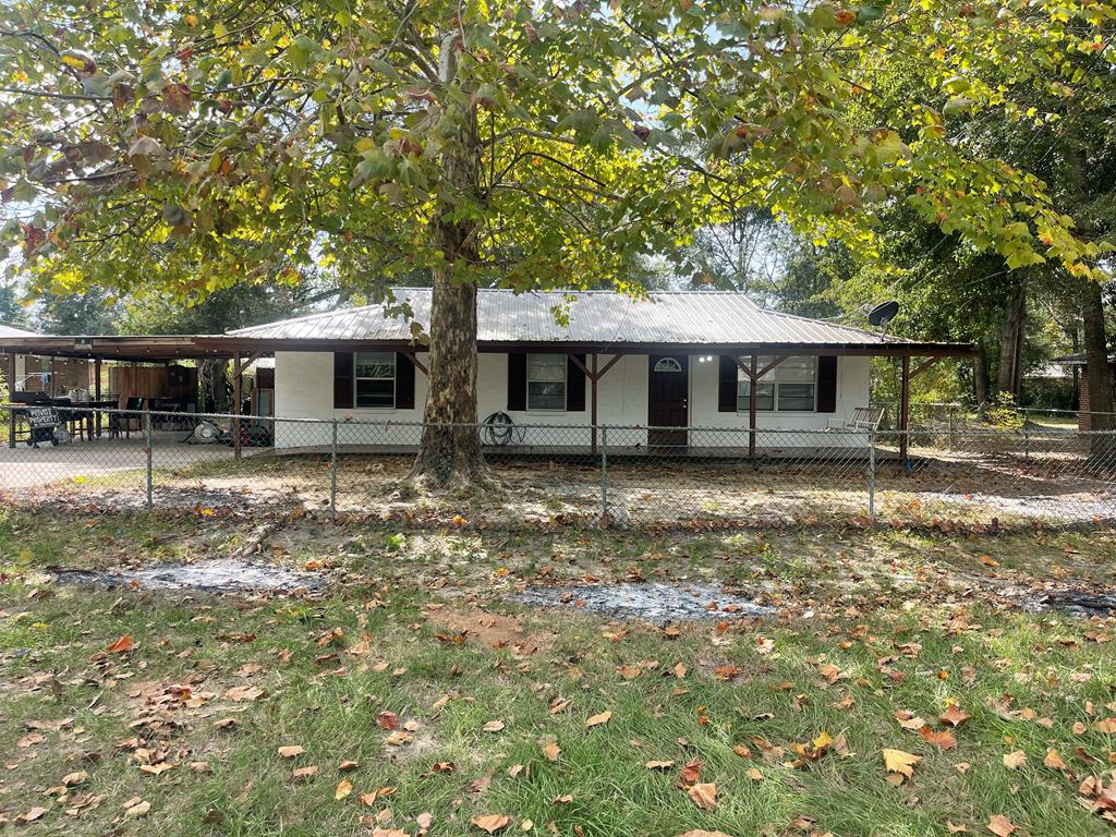 view of front of home featuring a carport