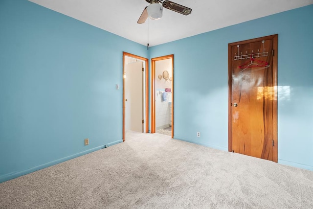 902 Moss St, Dothan, AL 36301 - unfurnished bedroom with carpet floors, baseboards, ceiling fan, and ensuite bathroom