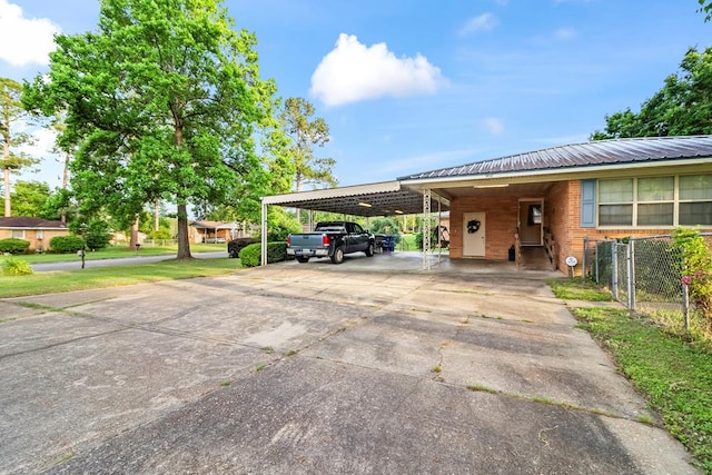 902 Moss St, Dothan, AL 36301 - view of vehicle parking with a carport and concrete driveway