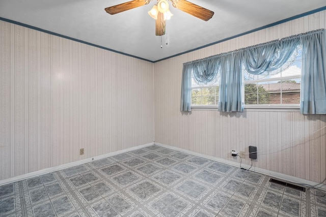 902 Moss St, Dothan, AL 36301 - empty room with tile patterned floors, ceiling fan, and baseboards