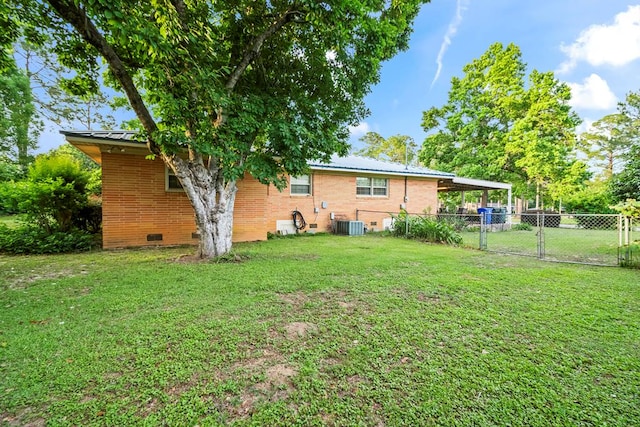 902 Moss St, Dothan, AL 36301 - back of house featuring brick siding, metal roof, a carport, a gate, and central air condition unit