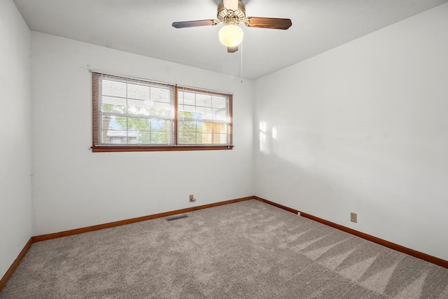 902 Moss St, Dothan, AL 36301 - carpeted spare room with baseboards and a ceiling fan