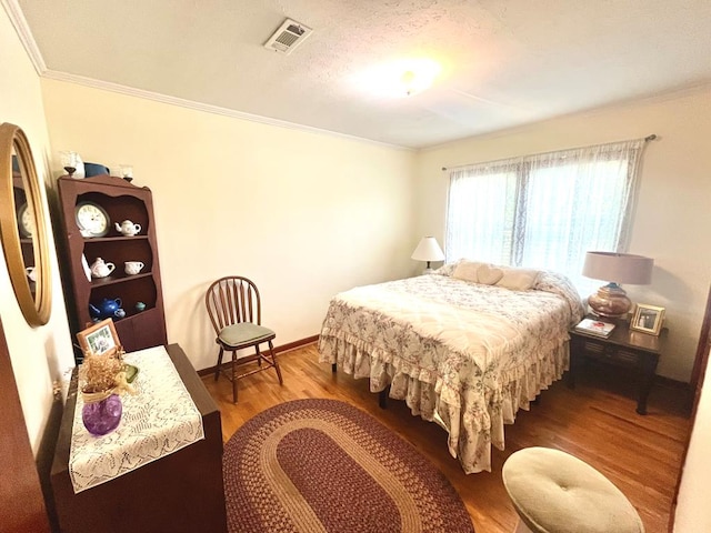449 County Road 112, Columbia, AL 36319 - bedroom with ornamental molding, wood finished floors, and baseboards