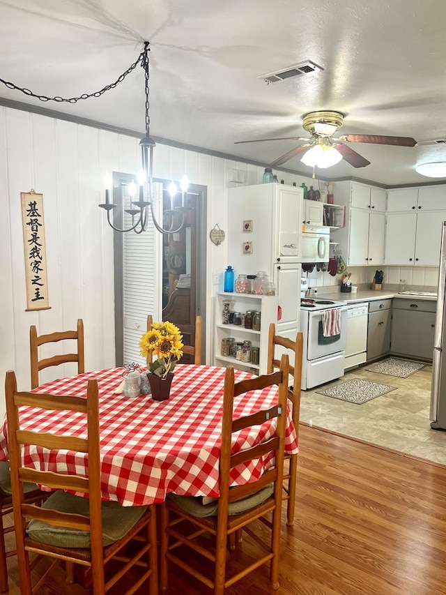 449 County Road 112, Columbia, AL 36319 - dining area featuring light wood finished floors, a chandelier, and ceiling fan