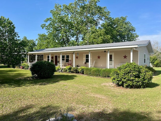 449 County Road 112, Columbia, AL 36319 - view of front facade featuring a front lawn, covered porch, ceiling fan, and metal roof