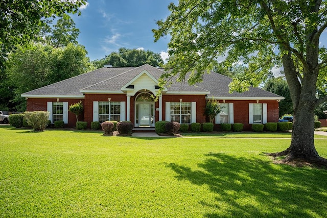 401 Dunleith Blvd, Dothan, AL 36303 - view of front of property with a front lawn, a shingled roof, and brick siding