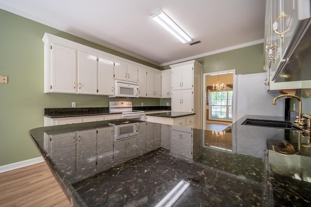 401 Dunleith Blvd, Dothan, AL 36303 - kitchen featuring white appliances, a sink, white cabinetry, crown molding, and dark stone counters