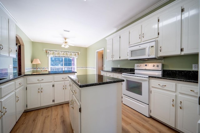 401 Dunleith Blvd, Dothan, AL 36303 - kitchen with white appliances, white cabinets, a kitchen island, light wood-style flooring, and ornamental molding