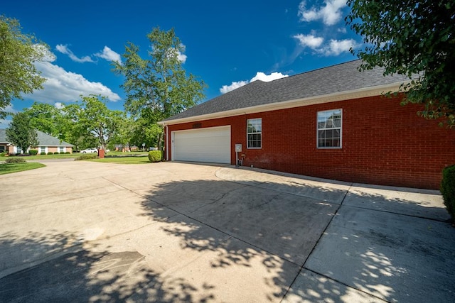 401 Dunleith Blvd, Dothan, AL 36303 - view of home's exterior featuring brick siding, an attached garage, and driveway