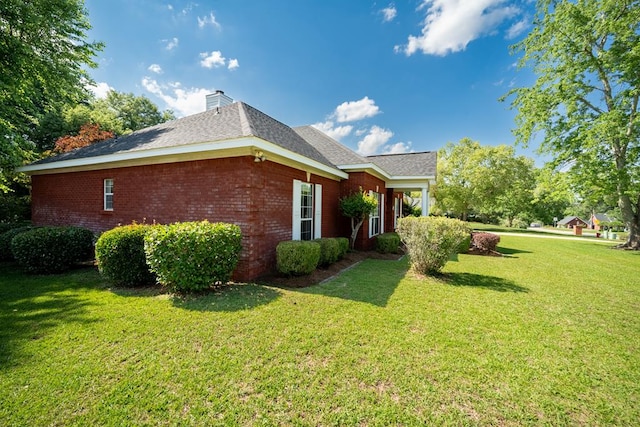401 Dunleith Blvd, Dothan, AL 36303 - view of home's exterior featuring brick siding, a yard, and a chimney
